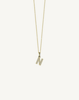 18k yellow gold diamond initial pendant. Luxury custom design. Initial N.